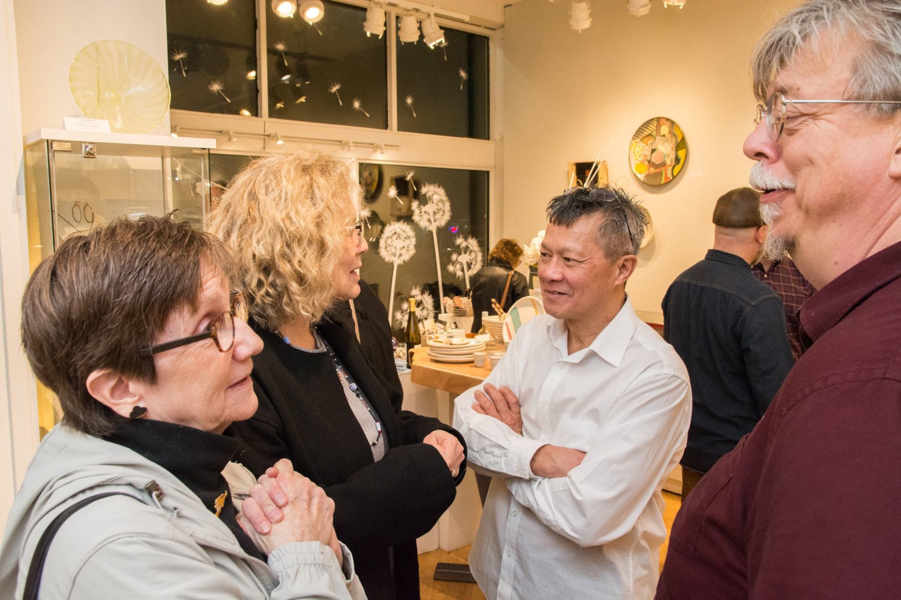 Guests mingle and chat with the artists